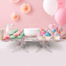 birthday cake and cupcakes in a clear square acrylic raised pastry stand