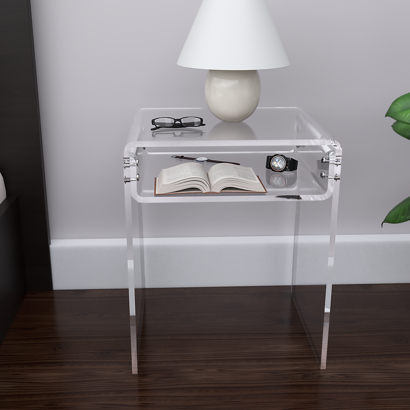 clear acrylic nightstand with a lamp and accessories by bed