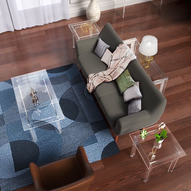 clear acrylic tables in livingroom with dark wood floors
