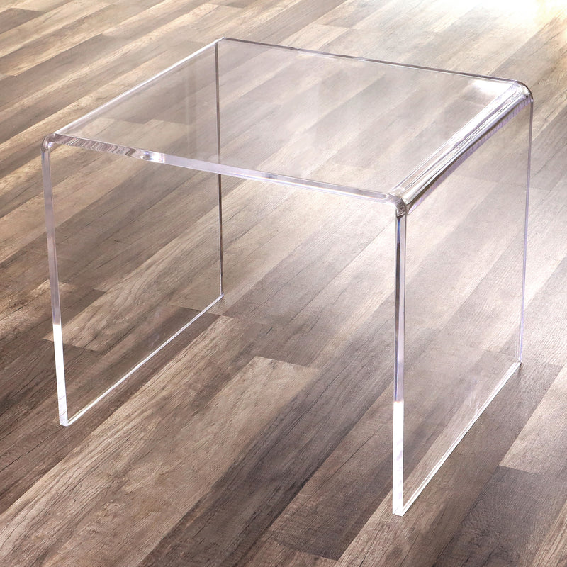 clear acrylic side table in wood floors
